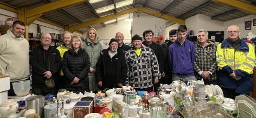 group photo in front of homeware products