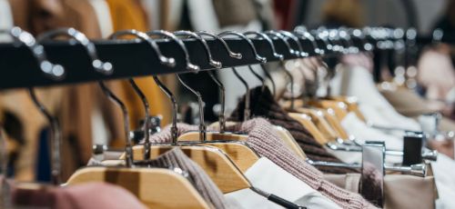 close up of coat hangers in a row